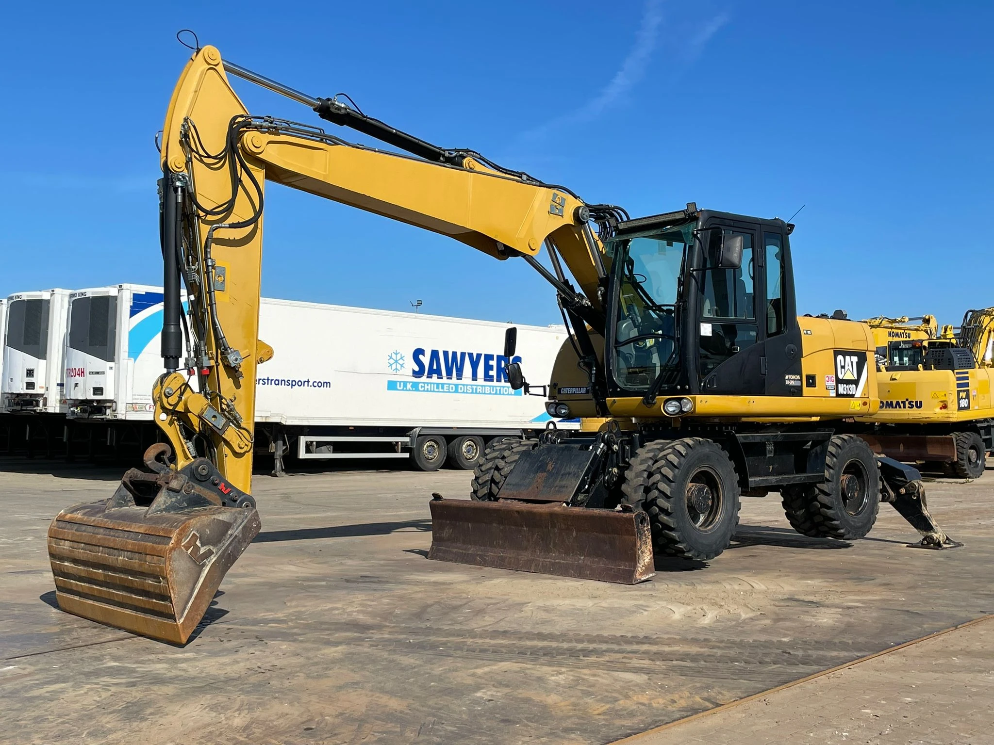 Caterpillar M313D VA - Outriggers + Blade 2012 Bild 2