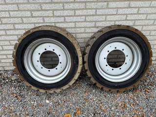 JLG N/A - E450AJ, OTR IN240/ 55D17.5 UNUSED solid tires + rims (set of 2) image 1
