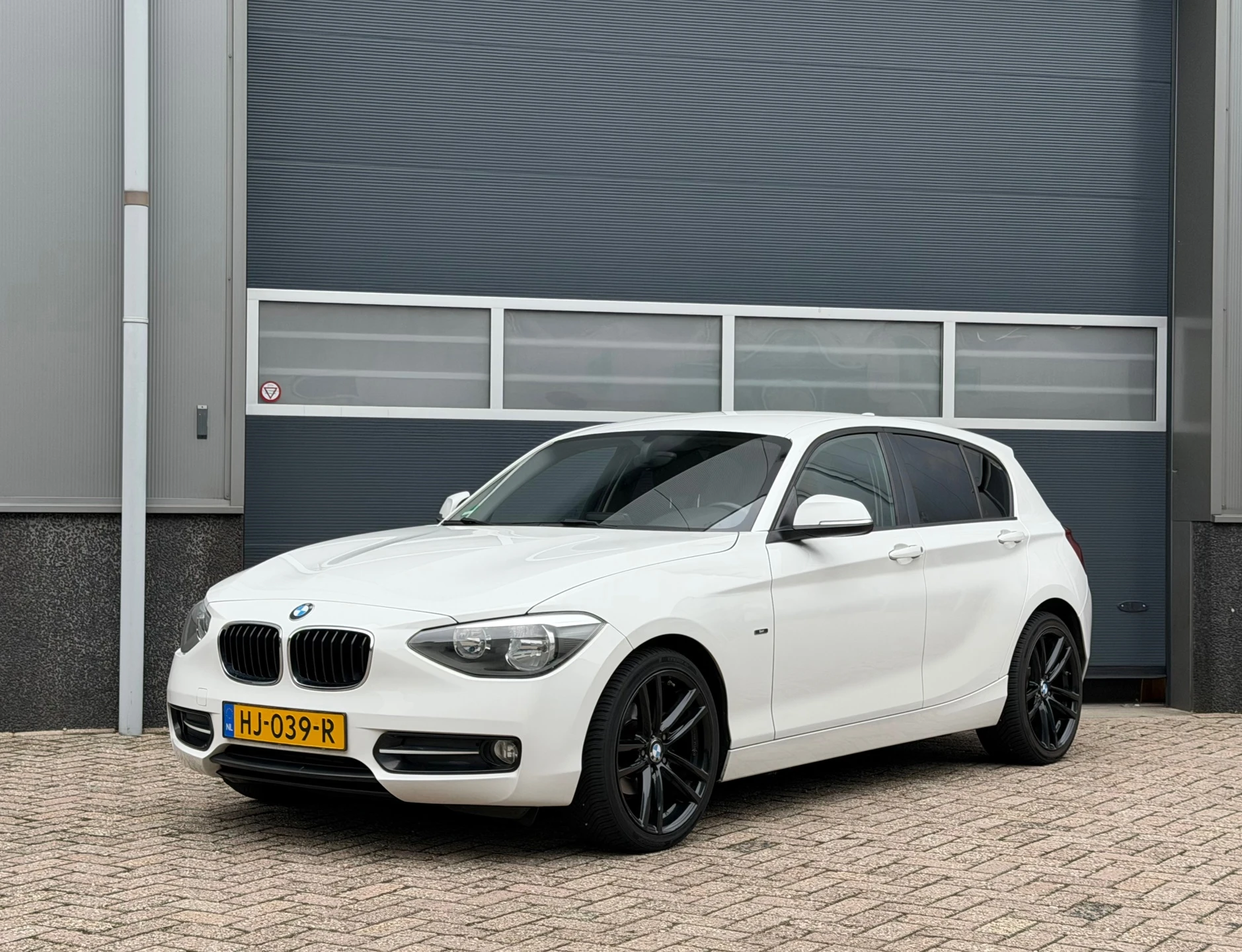BMW 1 Serie 2015 - 116i Sport bj.2015 Autom|Navi|5 Drs|Clima|Cc. afbeelding 1