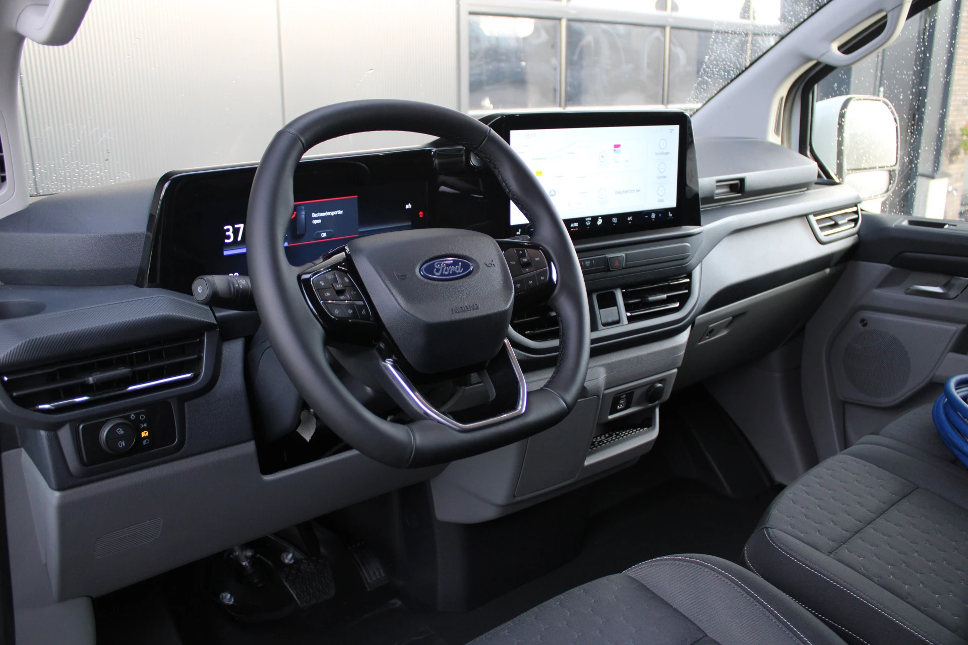 Ford E-Transit Custom 2025 - 340 L2H1 Limited 65 kWh 218pk - 2x Schuif - LED - 360 Camera - B&O - ACC - Navi - Stoel/Stuurverwarming - Rijklaar afbeelding 2