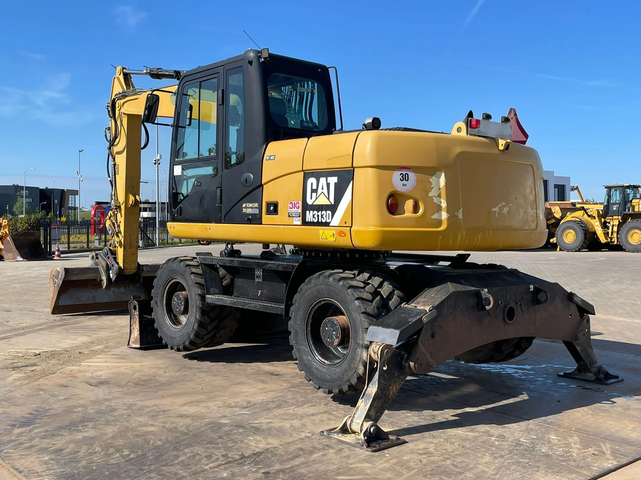 Caterpillar M313D VA - Outriggers + Blade 2012 Bild 3