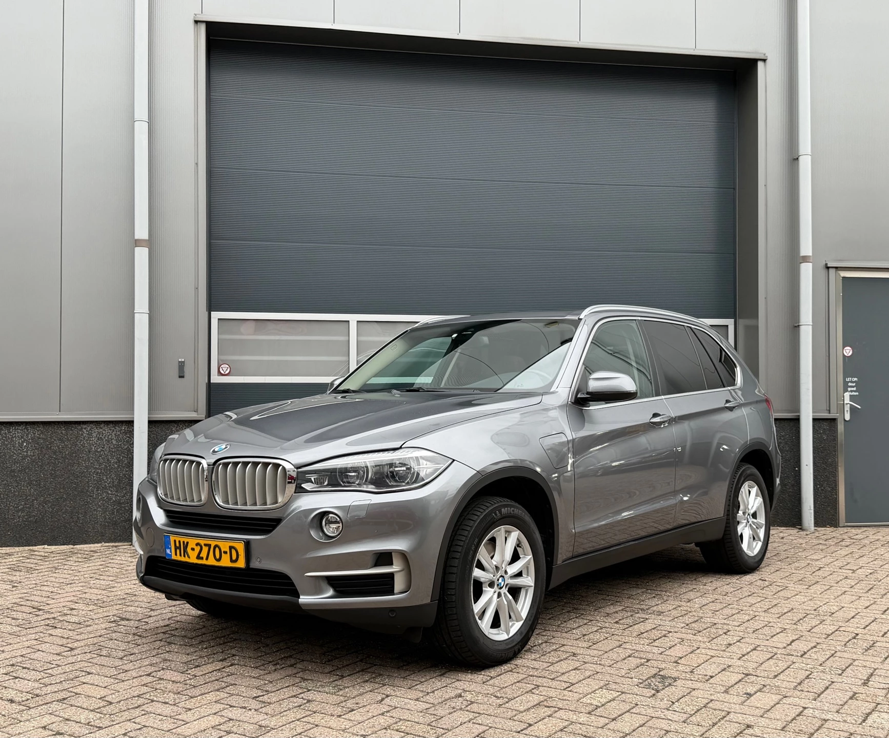 BMW X5 2015 - XDrive40e iPerformance High Executive bj.2015 Pano|Navi|Nap. afbeelding 1